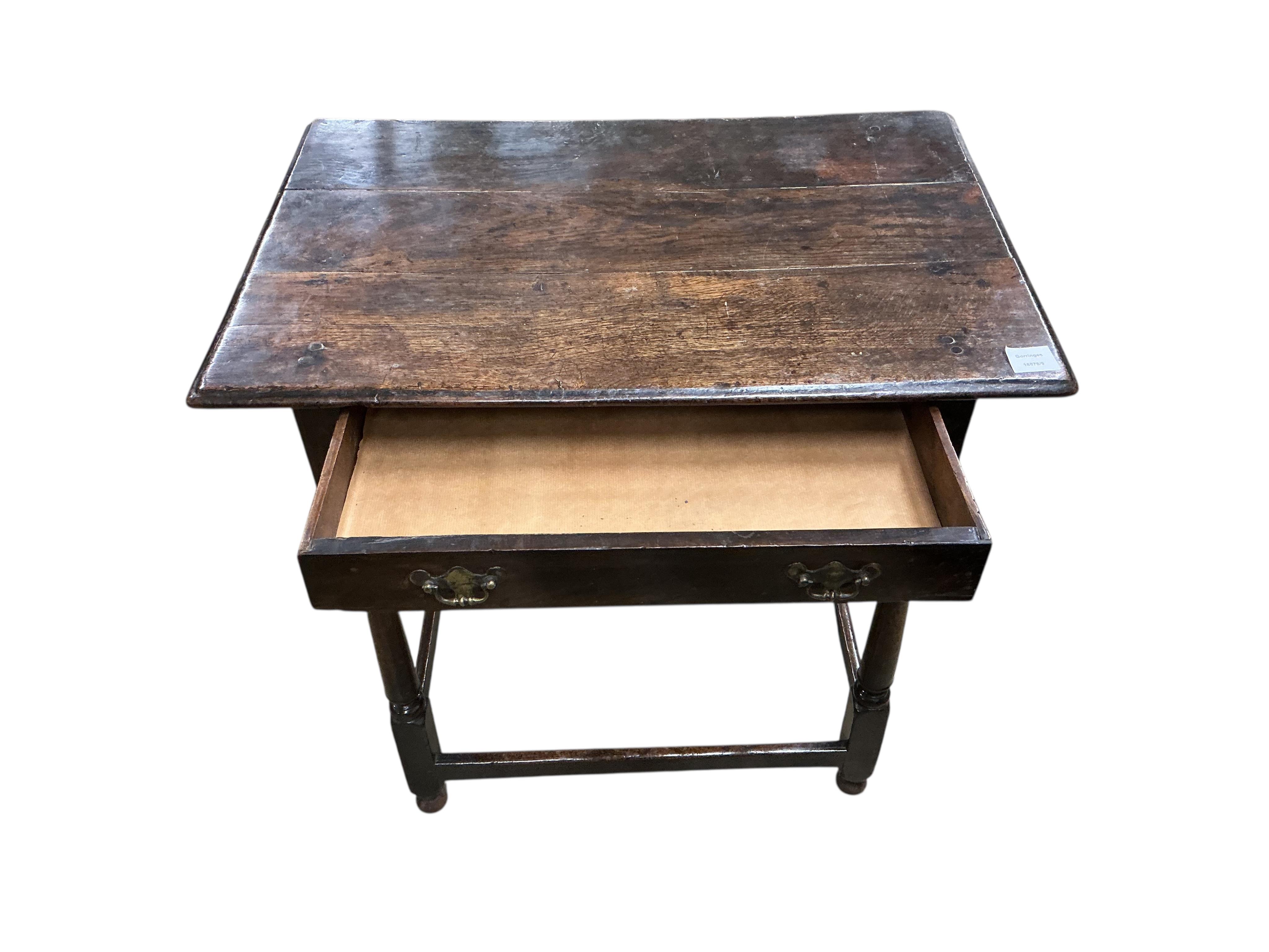 An early 18th century oak side table, fitted with a single long drawer, width 74cm, depth 49cm, height 74cm